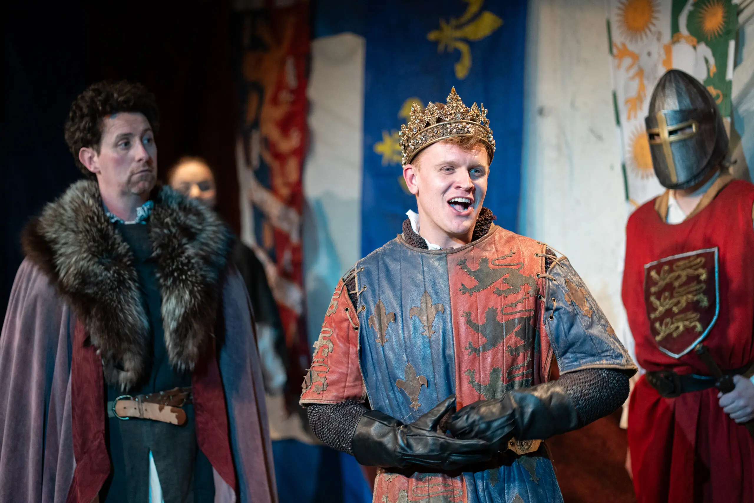 Henry V delivery a speech. Chorus member in the background