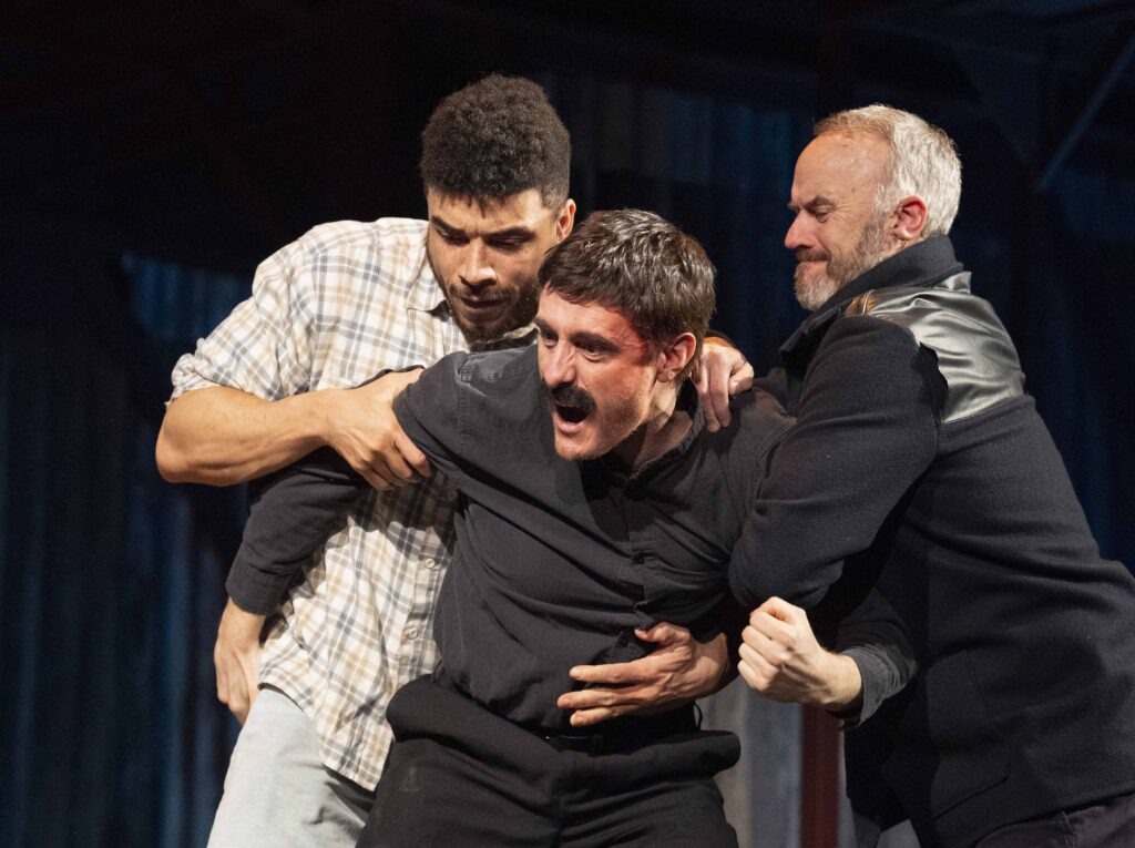 Jurell Carter (Loggo), Jay Johnson (Yosser) and Mark Womack (Dixie) - Loggo and Dixie holding back Yosser from a fight